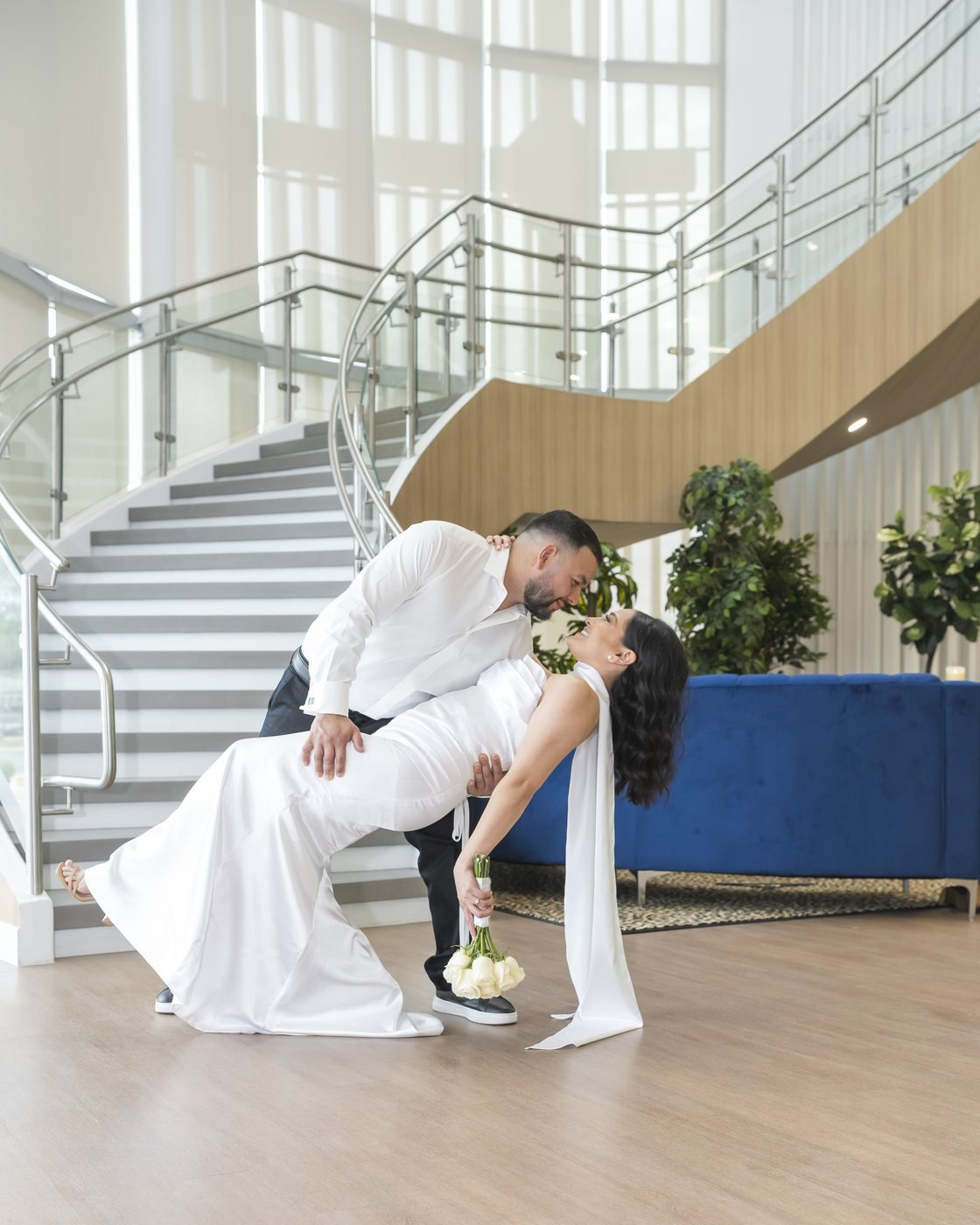Engagement session dip on the staircase at the Ellen Noel Art Museum, Odessa